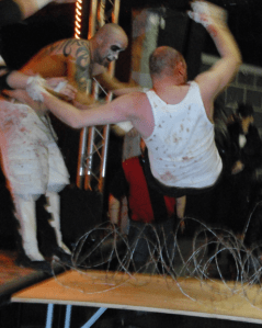 Chad Gowing (left) — better known as Warhed — slams Jesse "F'n" Amato through a barbed wire table in the night's main event.